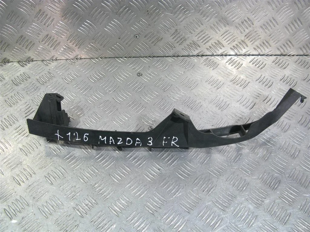 Кронштейн фары правой MAZDA 3 bk 2003-2009