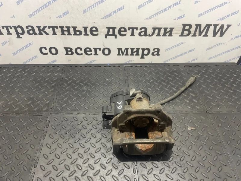 Суппорт тормозной Bmw 34216791017 F25 N52B30A, задний левый